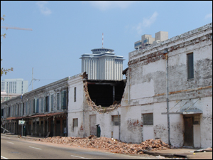 Category 5 winds caused extensive damage, including collapsed walls and complete building collapses.